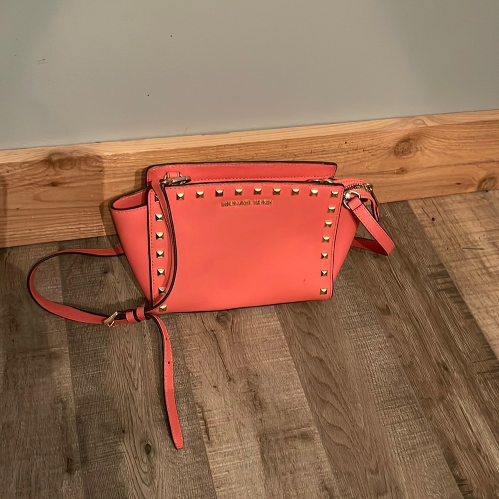 Michael Kors coral with gold studded accents purse 9” W x    7” H x 5-6” D